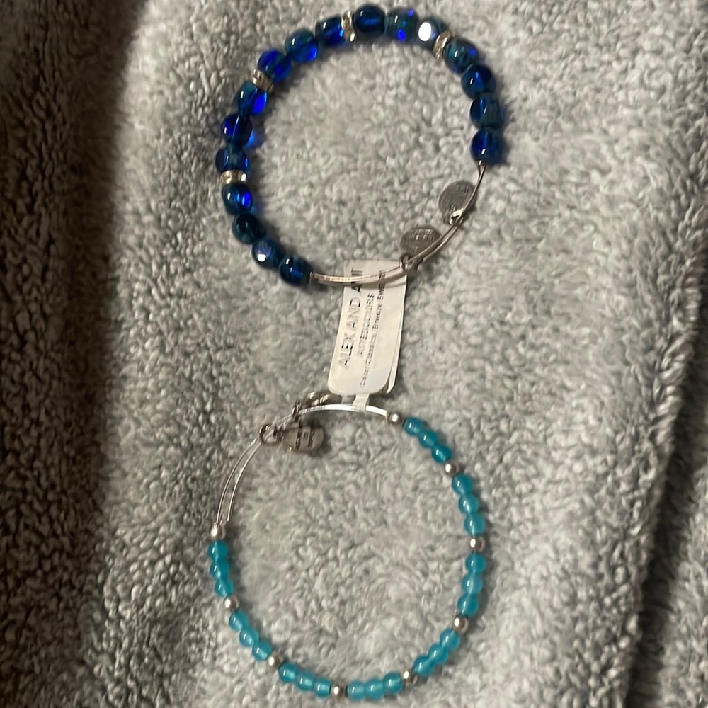 2 blue and silver Alex and Ani bracelets